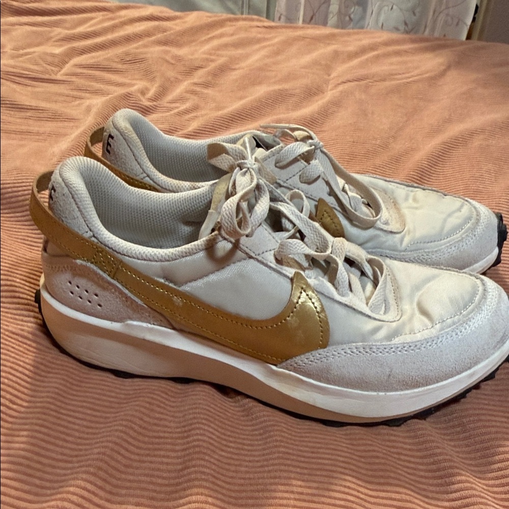 Nike Women's White Sneakers with Metallic Gold Swoosh